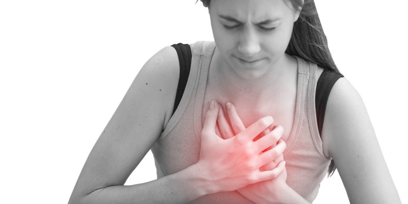 Black and white images showing a person holding both their hands on their chest. The area has been highlighted in red to indicate pain