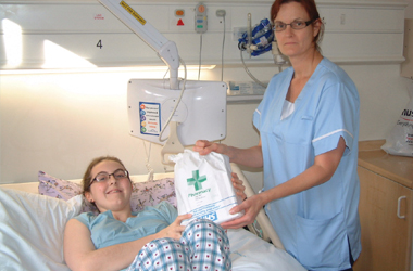 Ciaran with the ward nurse receiving her medication to take home