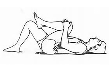 A person laying with their back to the floor and knees bent pulling one knee up to chest