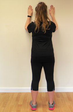 Stood with forearms on the wall