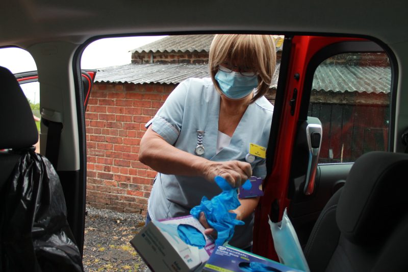 Ali getting her equipment out her car