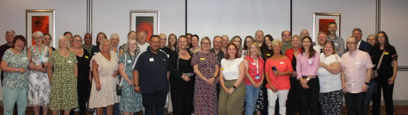 Group photo of staff and patients at the celebration event