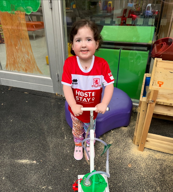 Evie donning a Middlesbrough FC shirt