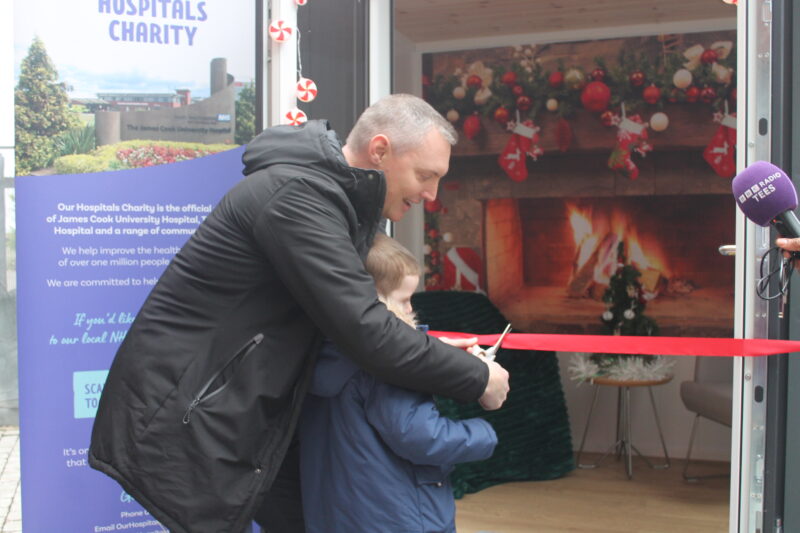 Andy and Charlie cut the ribbon