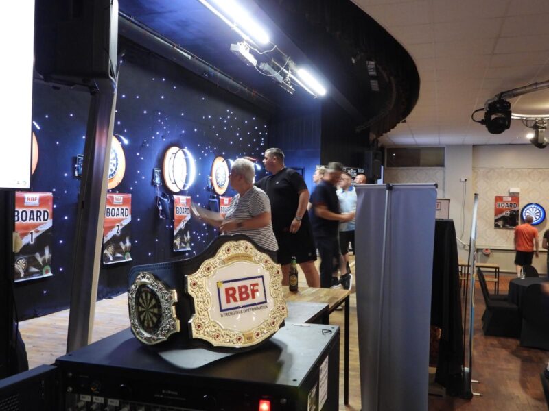 Darts players playing darts in a competition