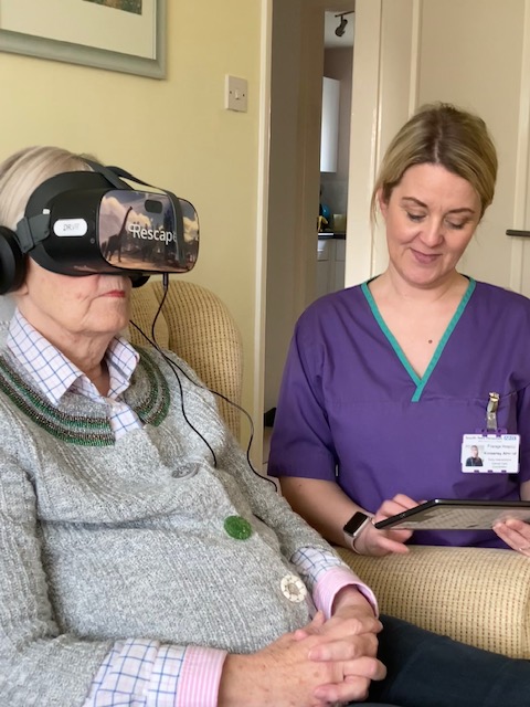 Kimberley Almond with Lynda as she tries the new VR headset