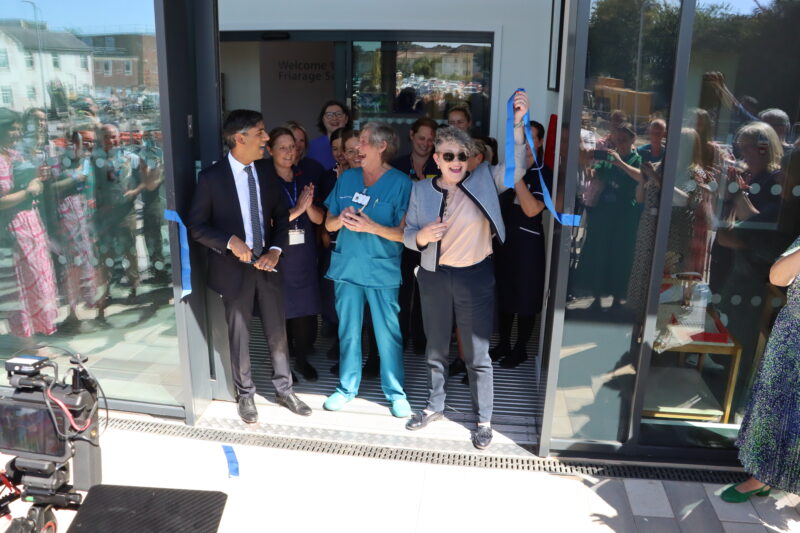 MP Rishi Sunak, 80-year-old scrub nurse Anne Lamb and Public health and prevention minister Ashley Dalton cutting the ribbon for the purpose-built facility