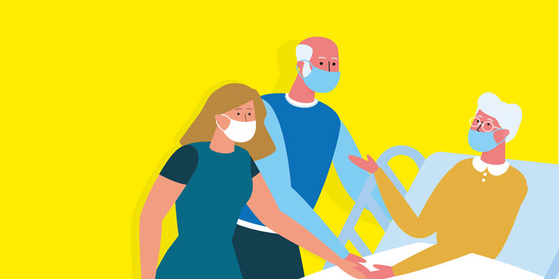 Two visitors with a patient in hospital