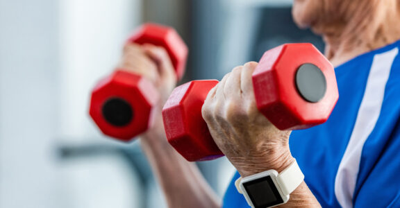 Hands holding weights