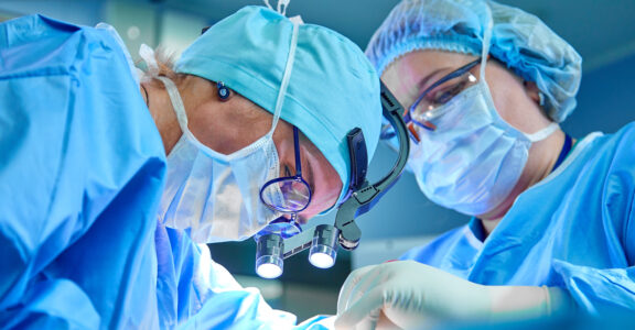 Close up of surgeons in operating theatre