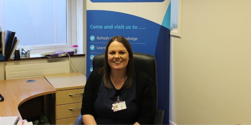 Julie sat at her desk smiling.