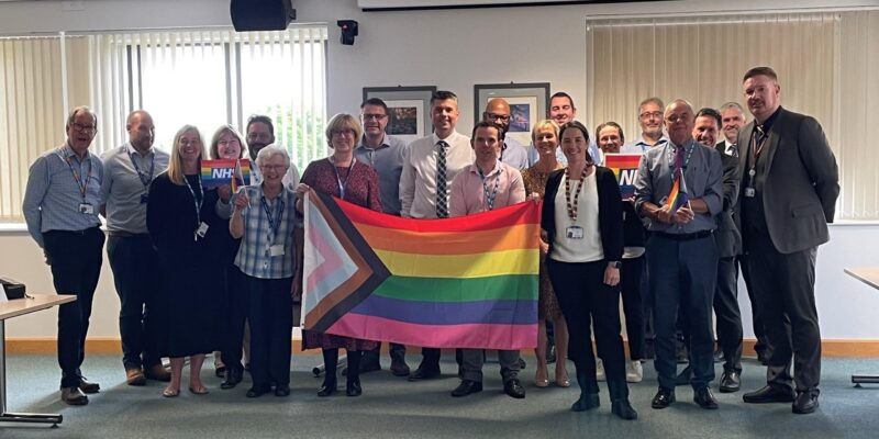Board with rainbow flag