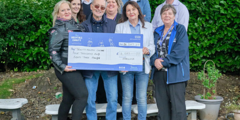 Fabulosa team handing the cheque to the Trinity Holistic Centre