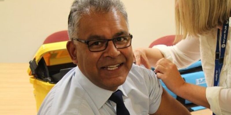 Medical director, Deepak Dwarakanath getting his flu jab