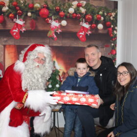 Santa in the Grotto with Andy, Debbie and Charlie Miller