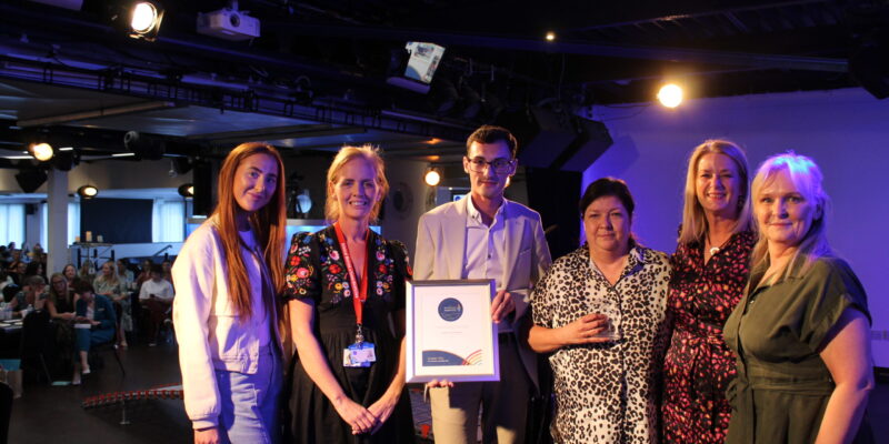 Group of people receiving an award