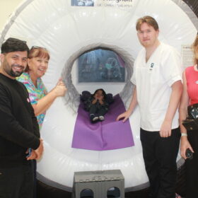 Mahwa Mohammadi,6, with her dad and staff from James Cook Hospital