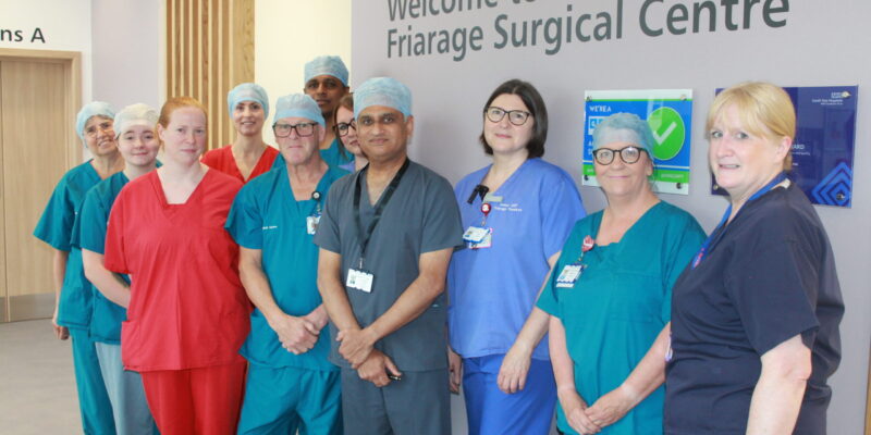 Dr Ashish Gulve and the team celebrating after operating on the 100th patient at the Friarage Hospital