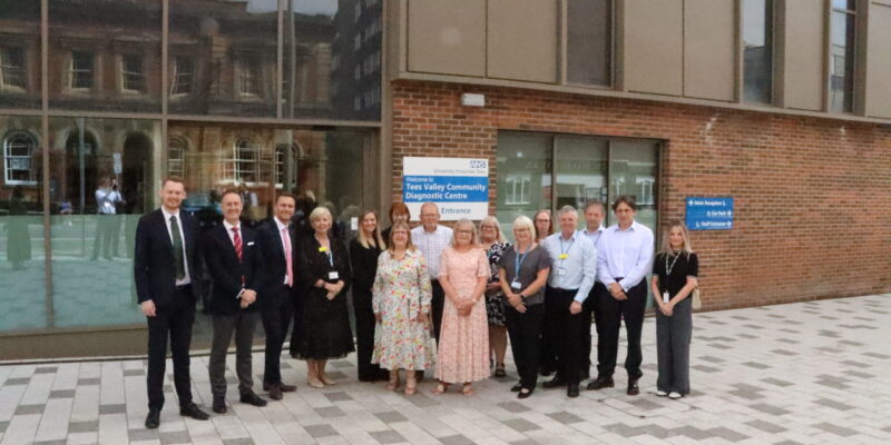 a group of people outside of the diagnostic centre