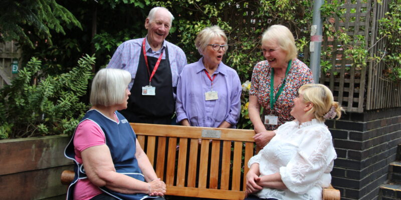Irene (left) with the volunteers and Georgina Oakley